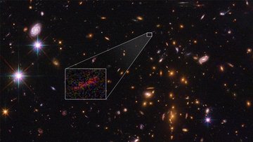 Eine Deep-Field-Aufnahme, auf der Galaxien über das Bild verteilt auf schwarzem Hintergrund liegen.