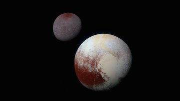 Der eisige Pluto (unten rechts im Vordergrund) und sein etwas kleinerer Mond Charon (oben links im Hintergrund).